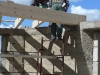 The carpenters laying the beams